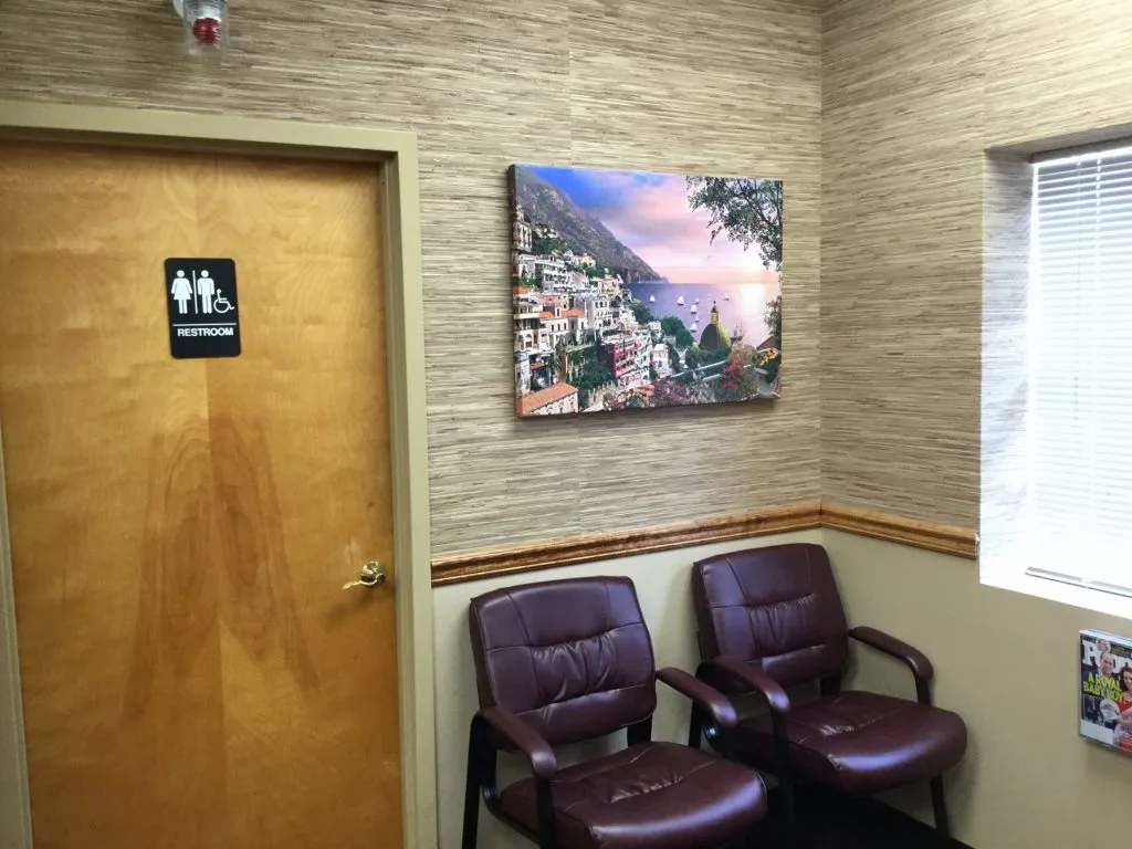 Interior photo: Podiatry patient waiting room and door to handicap-accessible restroom, Ronkonkoma NY