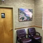Interior photo: Podiatry patient waiting room and door to handicap-accessible restroom, Ronkonkoma NY