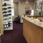 Interior photo: Front desk with waiting room and footwear and inserts on display, Ronkonkoma NY